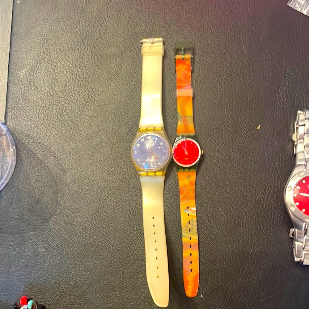 Two Swatch watches